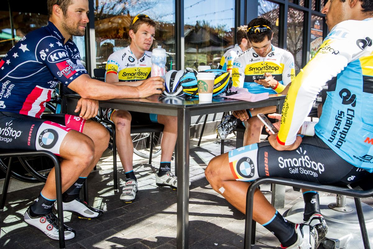 The team takes a coffee shop break after a long day in the saddle.