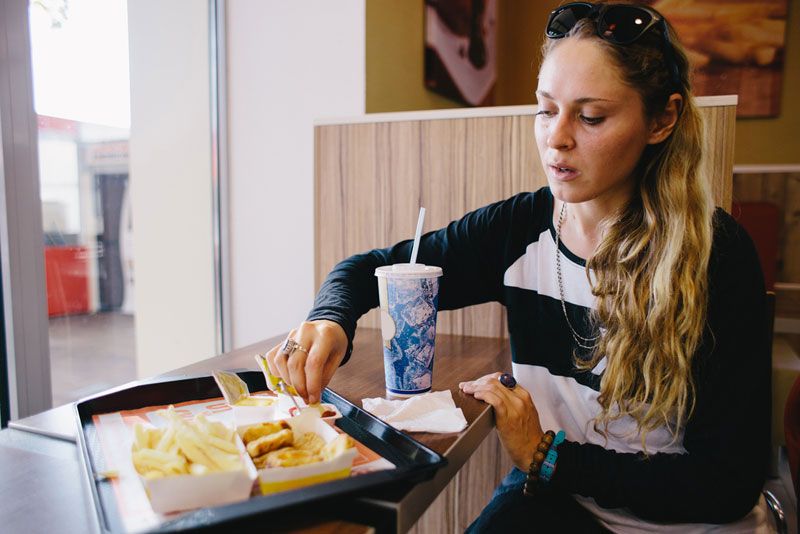 A young women with fast food