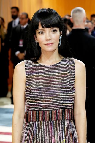 Lily Allen is pictured with black hair and a full fringes as she attends The 2022 Met Gala Celebrating "In America: An Anthology of Fashion" at The Metropolitan Museum of Art on May 02, 2022 in New York City.