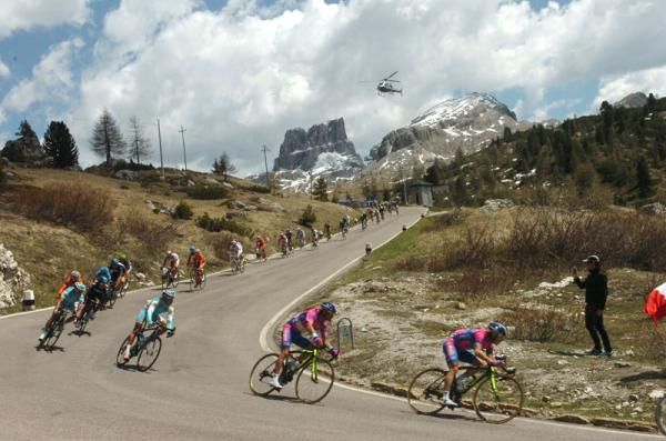 The peloton descend through some of Italy's most scenic landscapes