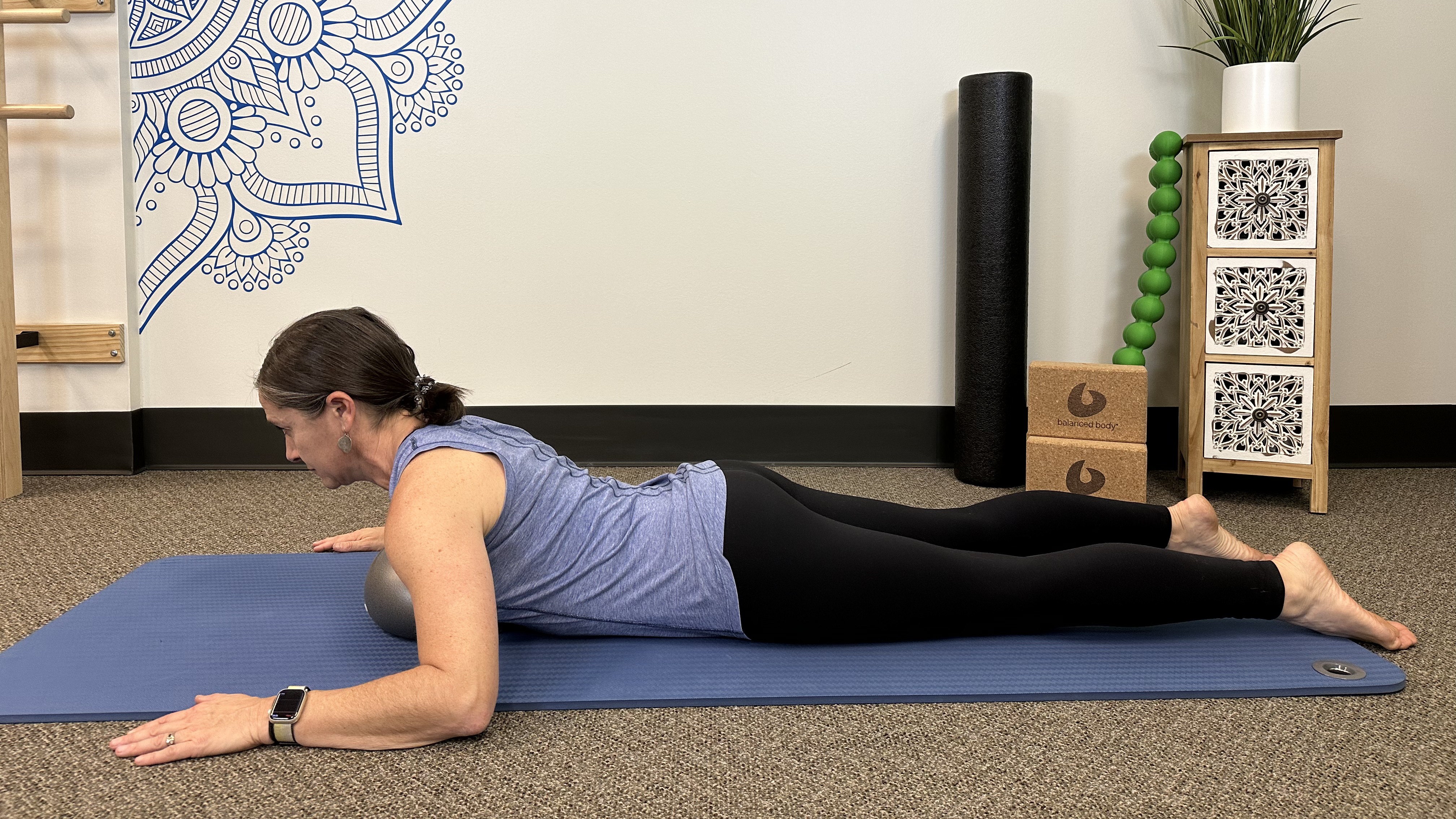 Woman demonstrates back stretch