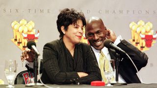 michael jordan of the chicago bulls r laughs as