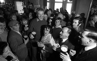 Donald Ginger McCain April 1973 trainer of Red Rum Racehorse Pictured as he celebrates drinking Guinness with stable lads in pub