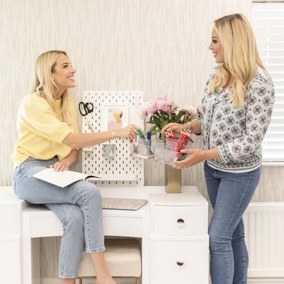 womens working with pegboard and caddy holder