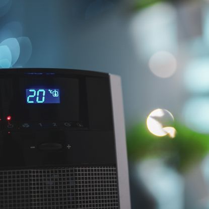 Close up of the temperature display and control panels of an electric heater