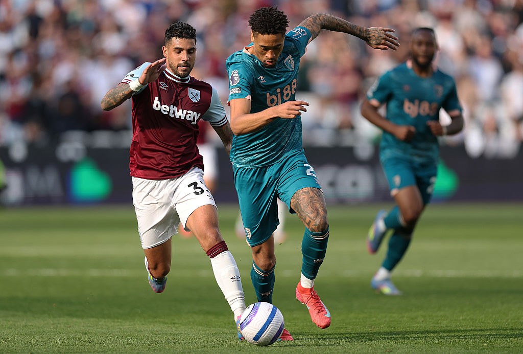 Daniel Jebbison of AFC Bournemouth is challenged by Emerson Palmieri of West Ham United (L) during the Premier League match between West Ham United FC and AFC Bournemouth at London Stadium on April 05, 2025 in London, England.