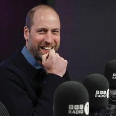 Prince William sitting in front of BBC microphones and smiling