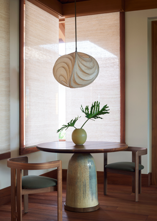 A dining room with grounded wooden accents