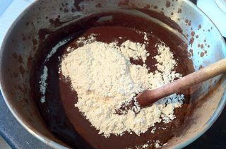 Mixing ingredients for chocolate cola cake