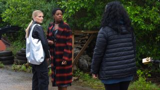 Dee-Dee Bailey and Bethany Platt look shocked as they talk to a woman.