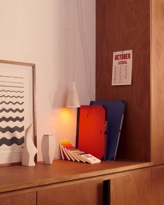 Calendar and stationery items on sideboard