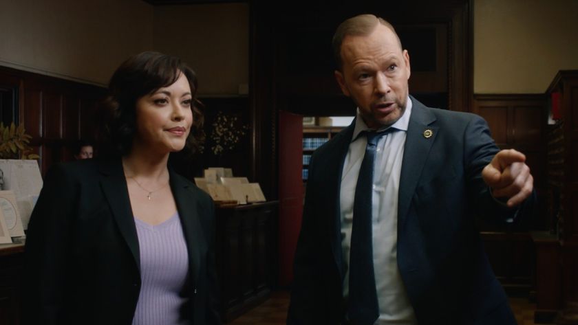(L-R): Marisa Ramirez as Maria Baez and Donnie Wahlberg as Danny Reagan pointing with his right hand. 