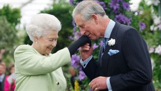 Queen Elizabeth II presents Prince Charles, Prince of Wales with the Royal Horticultural Society's Victoria Medal of Honour during a visit to the Chelsea Flower Show on May 18, 2009 in London. The Victoria Medal of Honour is the highest accolade that the Royal Horticultural Society can bestow.
