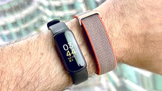 Close-up of the Fitbit Inspire 3 next to the Fitbit Air on a user's wrist