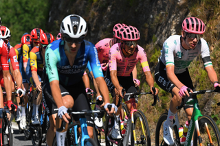 Richard Carapaz rides behind teammate Darren Rafferty at the Vuelta a España