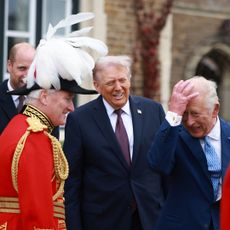 WINDSOR, ENGLAND - SEPTEMBER 17: US President Donald Trump (C) is welcomed to Windsor Castle by King Charles III (R) and Prince William, Prince of Wales on day two of the US President Donald Trump's second state visit to the UK on September 17, 2025 in Windsor, England. (Photo by Ian Vogler - WPA Pool/Getty Images)