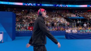 Olympic swimmer Oliver Morgan from team GB approaches the pool.