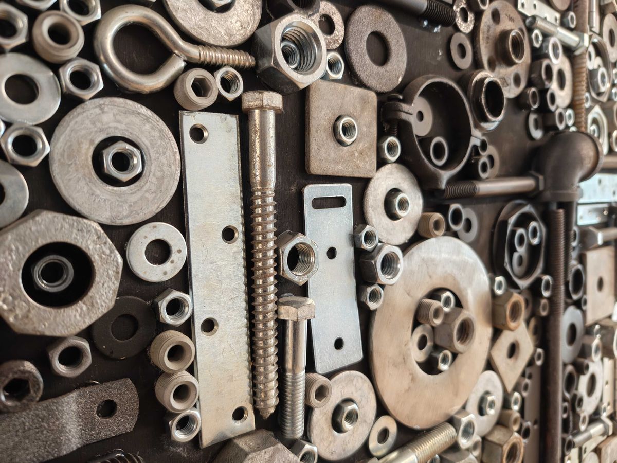 Screws, nuts, and bolts on a wall