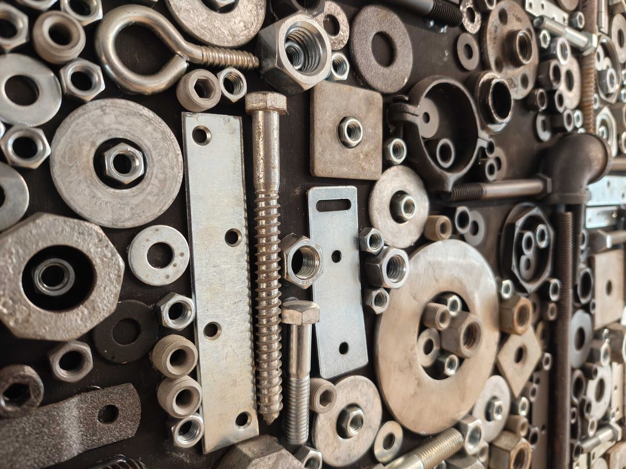 Screws, nuts, and bolts on a wall