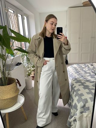 Florrie wears a trench coat from H&M