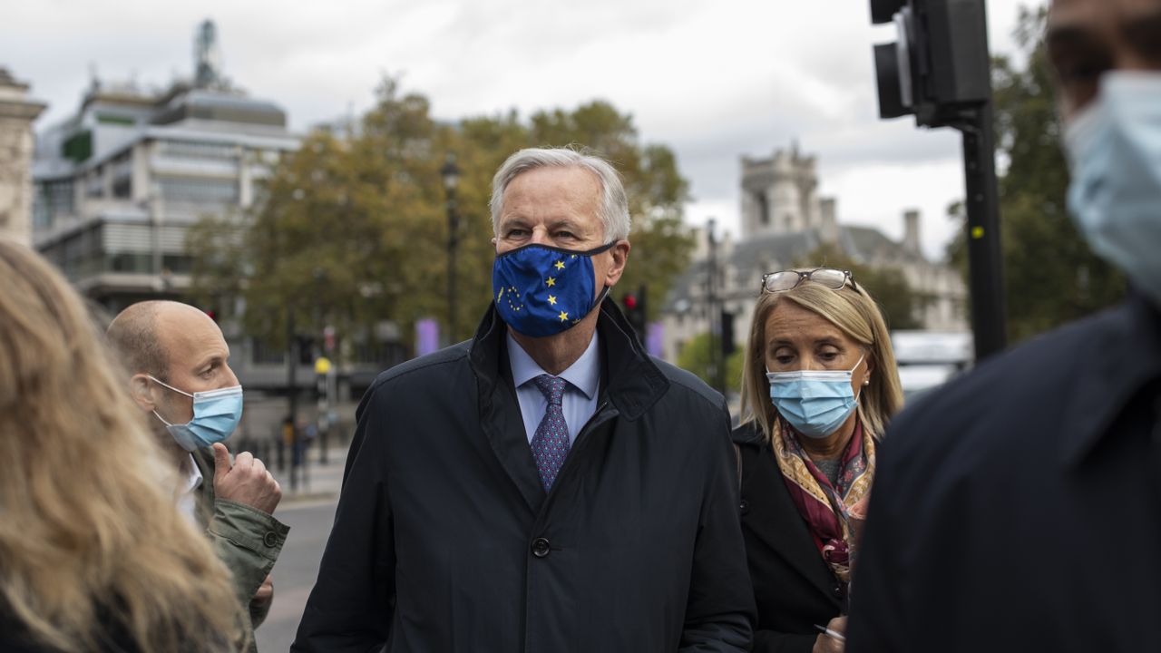 EU Brexit negotiator Michel Barnier walks with members of the EU delegation in London.