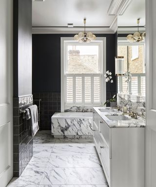 Gray bathroom with dark painted wall