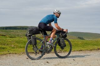 Male cyclist wearing the Pearl Izumi Attack Bib Shorts whilst cycling on the Trans Cambrian Way