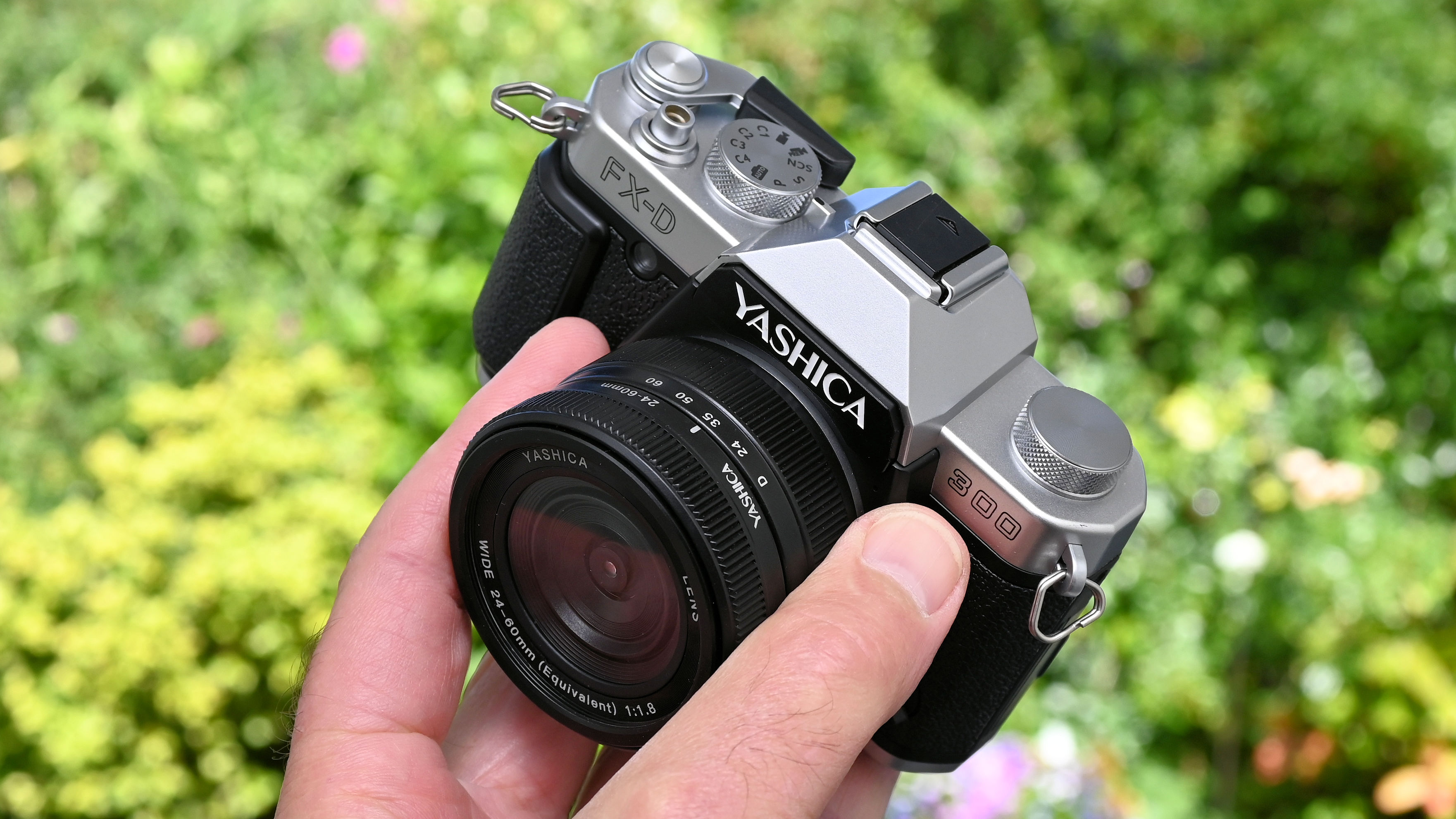 Yashica FX-D 300 product shot, camera held in hand