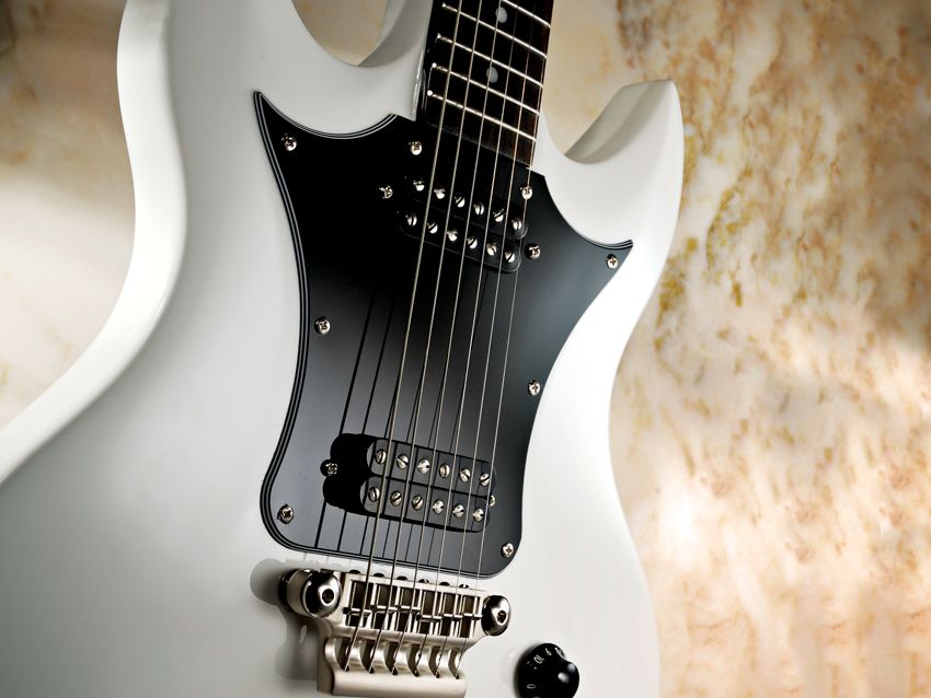 The Vox Series 22's doublecut body doesn't have the fancy ash top of more expensive Vox models, but it plays like the more rugged brother of the SG.