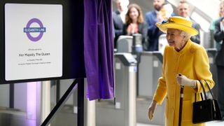 Queen Elizabeth II unveils a plaque to mark the Elizabeth line's official opening at Paddington Station on May 17, 2022 in London, England.