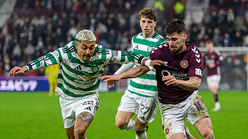 Claudio Braga (R) of Hearts holds off Julian Ajauro of Celtic during the Premiership match between Heart of Midlothian and Celtic at Tynecastle Park on January 25, 2026.  