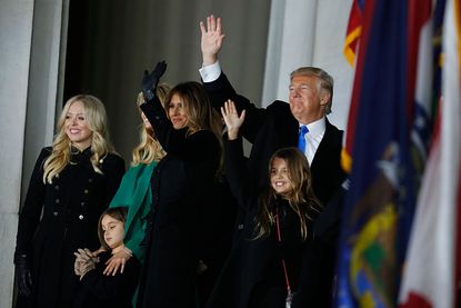 Donald Trump and his family wave to the crowd.