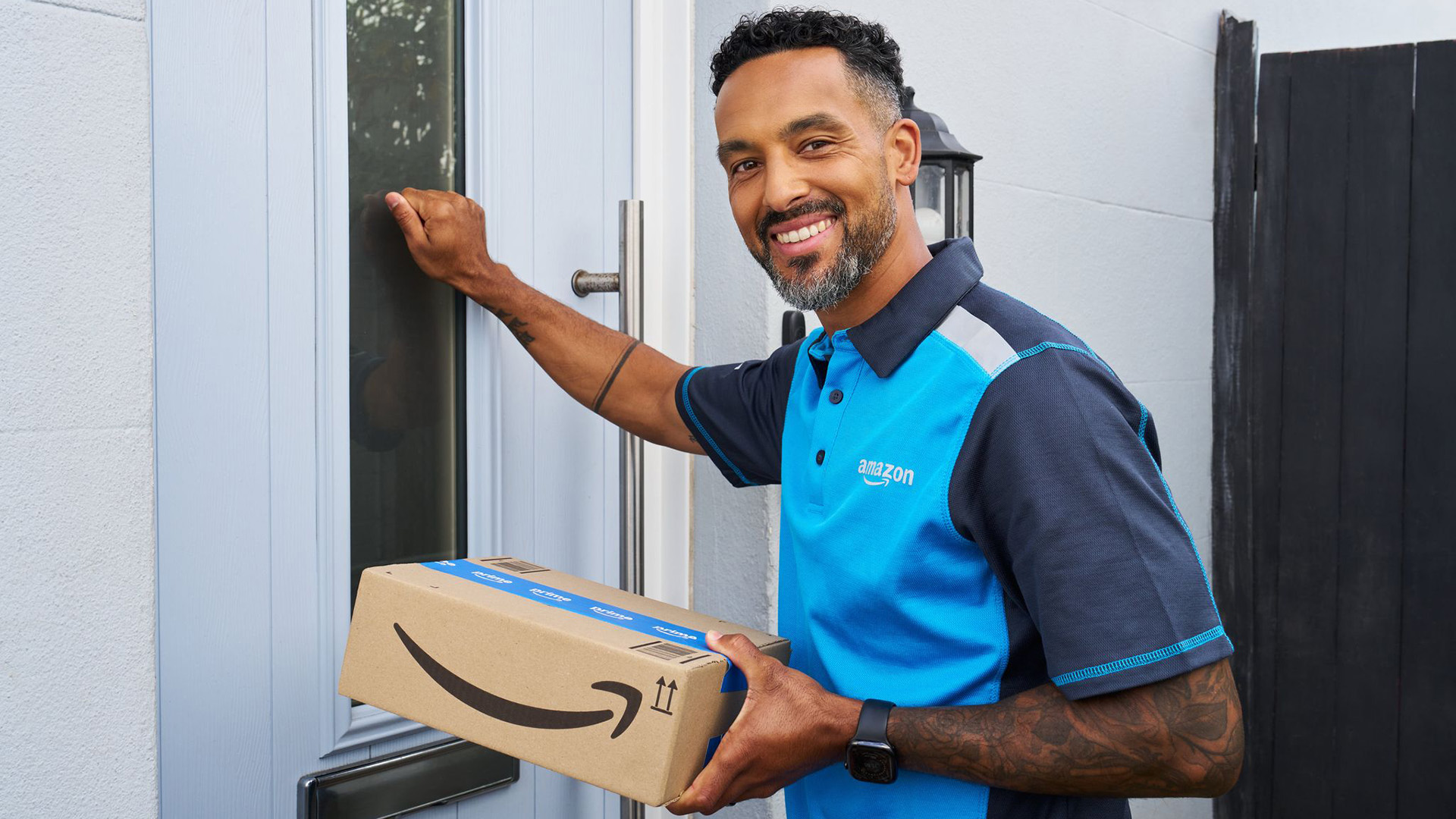 Theo Walcott delivers Amazon Prime parcel on Prime Day