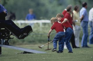Prince William and Prince Harry playing polo as children