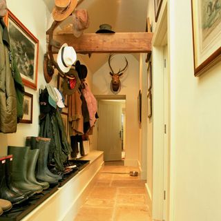 hallway with shoes and hats
