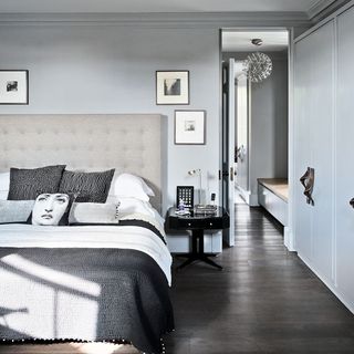 bedroom with grey wall and wooden flooring