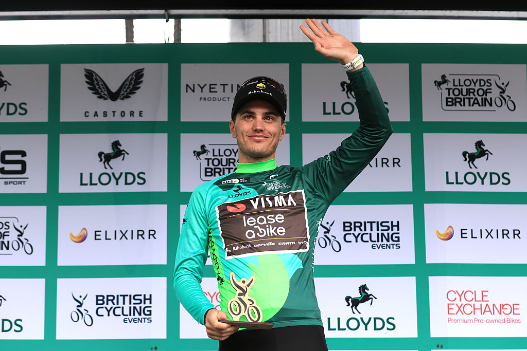 STOWMARKET, ENGLAND - SEPTEMBER 03: Olav Kooij of Netherlands and Team Visma | Lease a Bike celebrates at podium as Green Leader Jersey winner during the 21st Tour of Britain 2025, Stage 2 a 169.3km stage from Stowmarket to Stowmarket on September 03, 2025 in Stowmarket, England. (Photo by Stephen Pond/Getty Images)