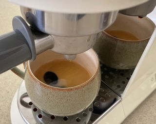 Close-up of making espresso with Smeg coffee maker