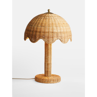 rattan-covered table lamp with scalloped rim