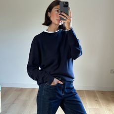 woman in navy sweater and jeans