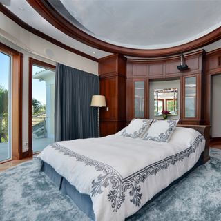 shania twain house master bedroom with round design element and private balcony