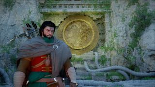 Crimson Desert Trembling Woods puzzle: Kliff standing with the golden puzzle mural in the ruins behind him.