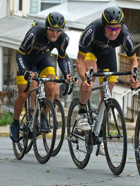 Benjamin King and Ryohei Komori (Trek/Livestrong) strain to get over the steep little climb in their big rings.