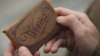 Close up of a Wonka chocolate bar from the Wonka ending