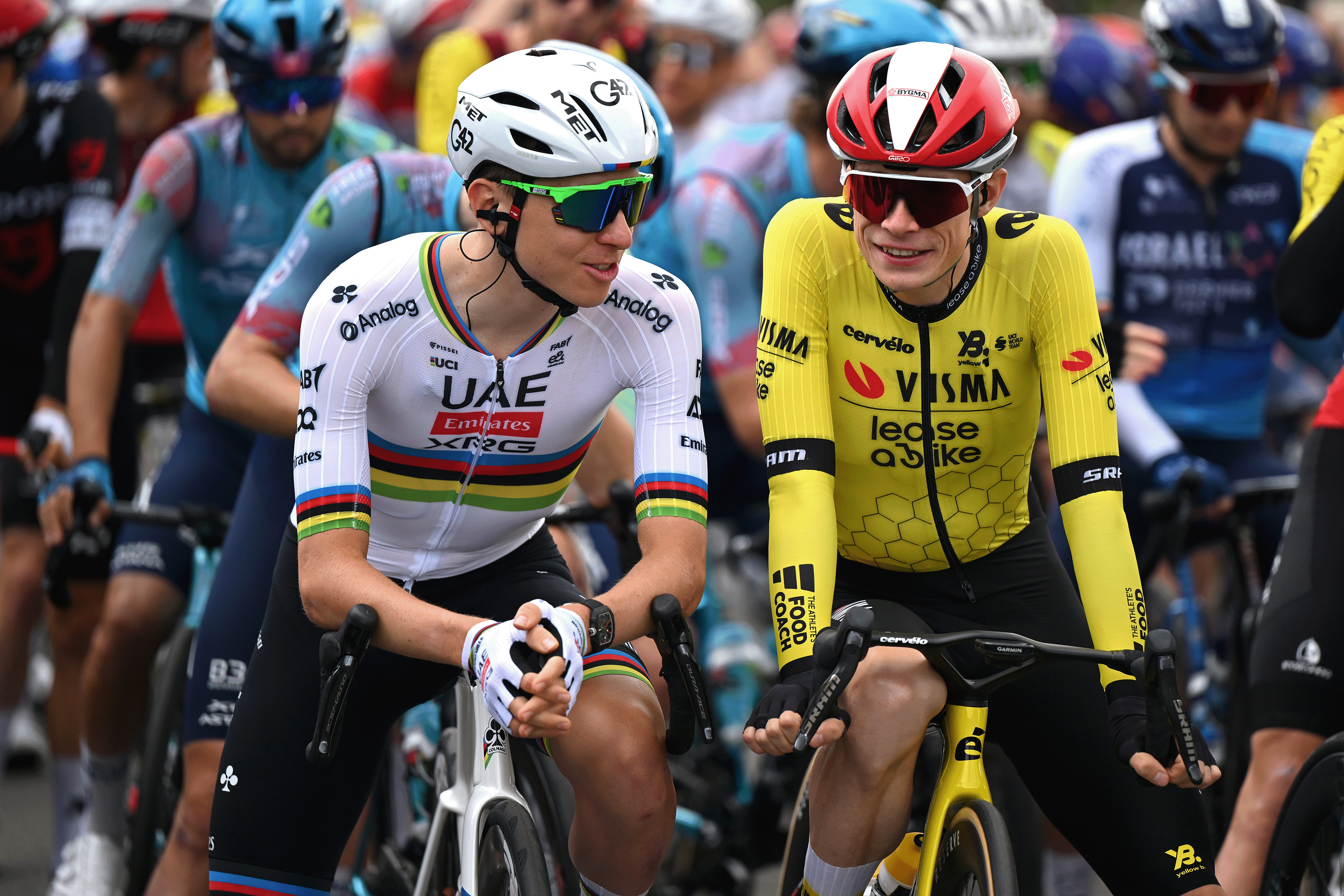 DOMERAT, FRANCE - JUNE 08: (L-R) Tadej Pogacar of Slovenia and UAE Team Emirates - XRG and Jonas Vingegaard of Denmark and Team Visma | Lease a Bike prior to the 77th Criterium du Dauphine 2025, Stage 1 a 195.8km stage from Domerat to Montlucon / #UCIWT / on June 08, 2025 in Domerat, France. (Photo by Dario Belingheri/Getty Images)