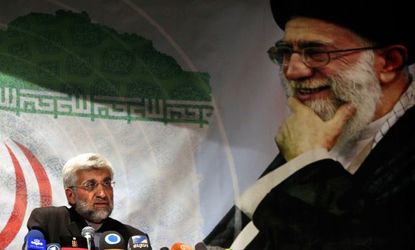 Presidential candidate Saeed Jalili speaks under an oversized portrait of the Iranian supreme leader during a campaign rally on May 29.