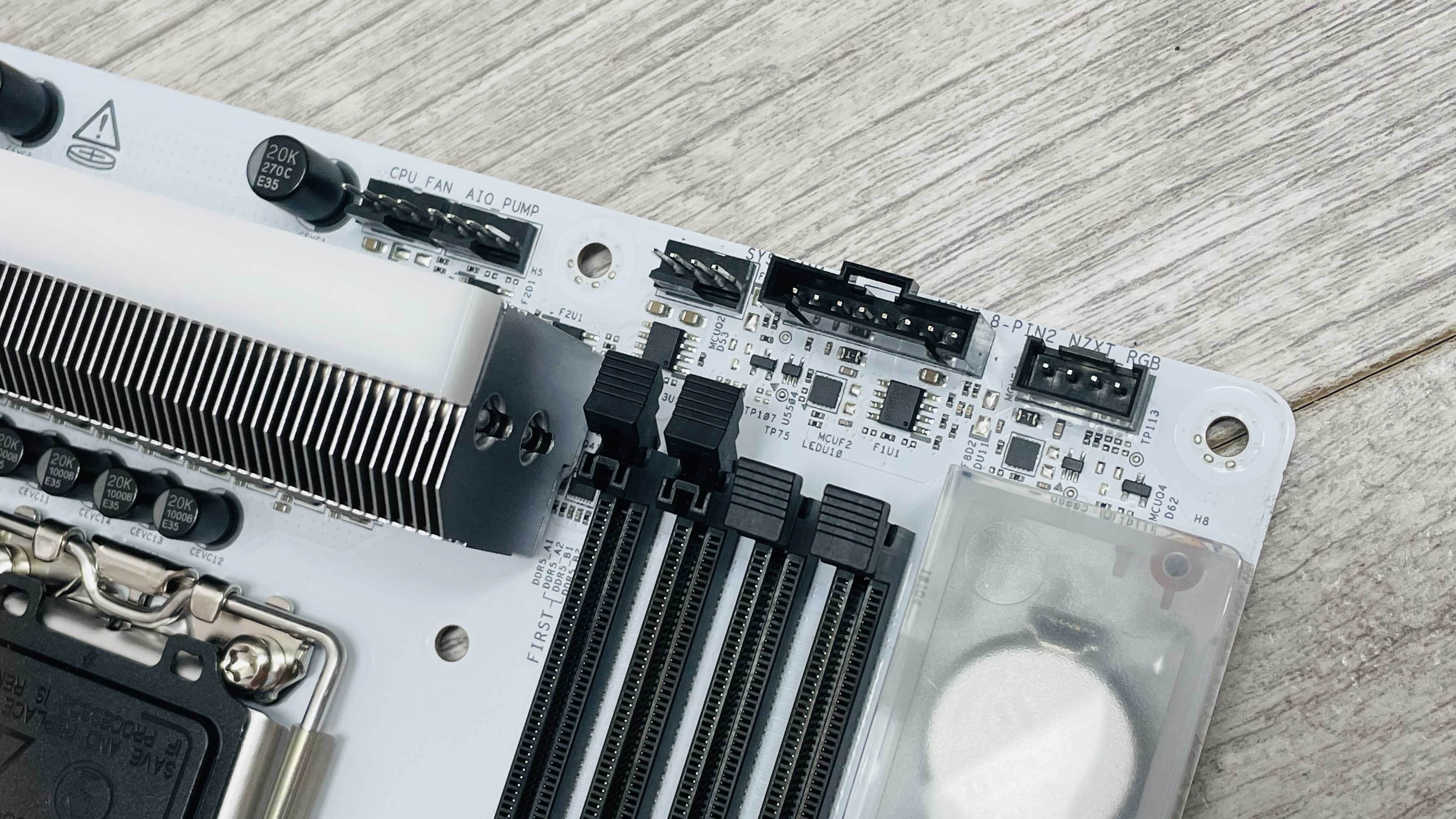 An NZXT N9 Z890 motherboard on a desk with port covers removed.