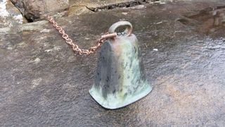 Local people found the bronze hand bell had been stolen from St Finan's Isle in July, despite having been secured to the ruined chapel building by a heavy chain.