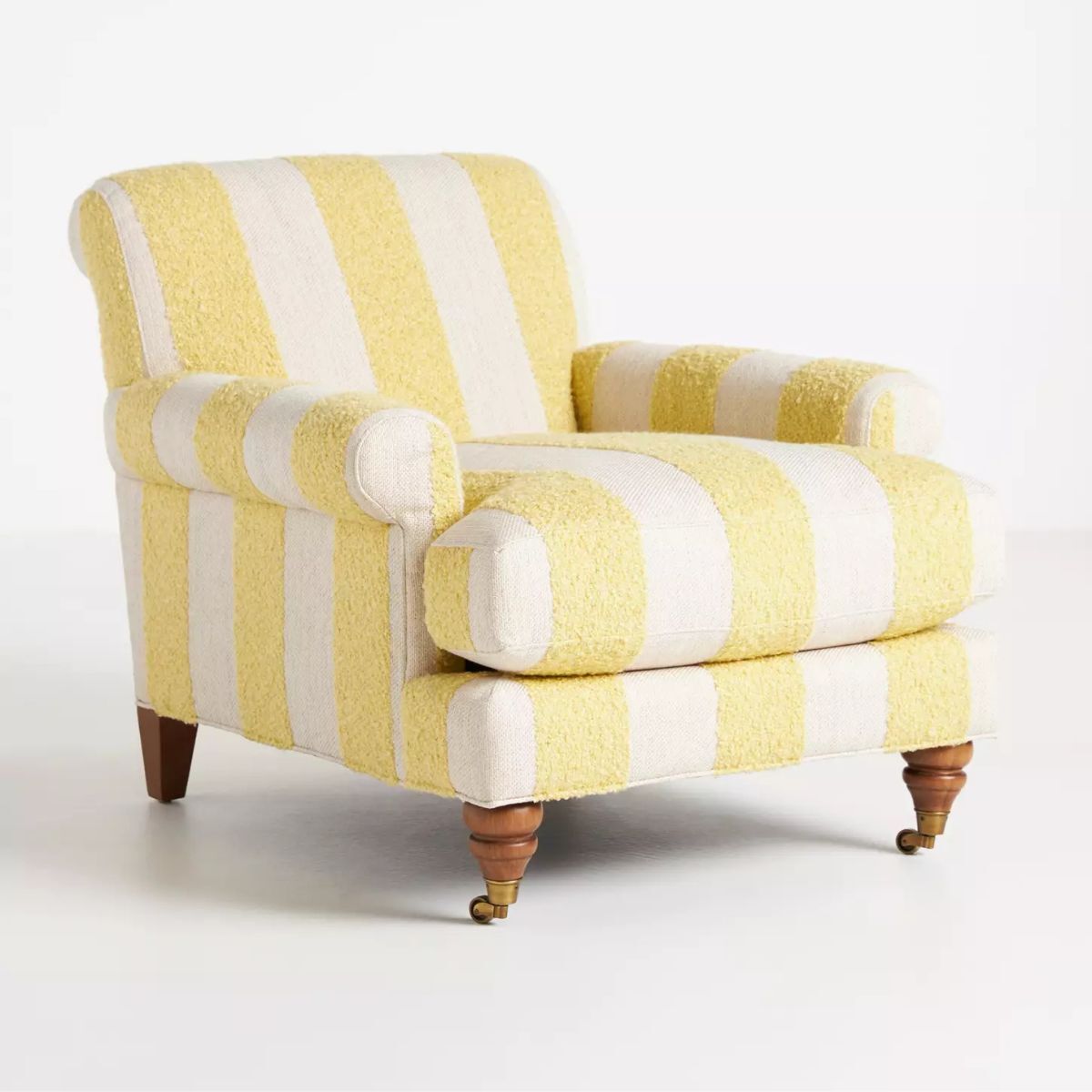 A yellow and white striped armchair