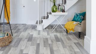 pale grey wood effect LVT in hallway with white staircase